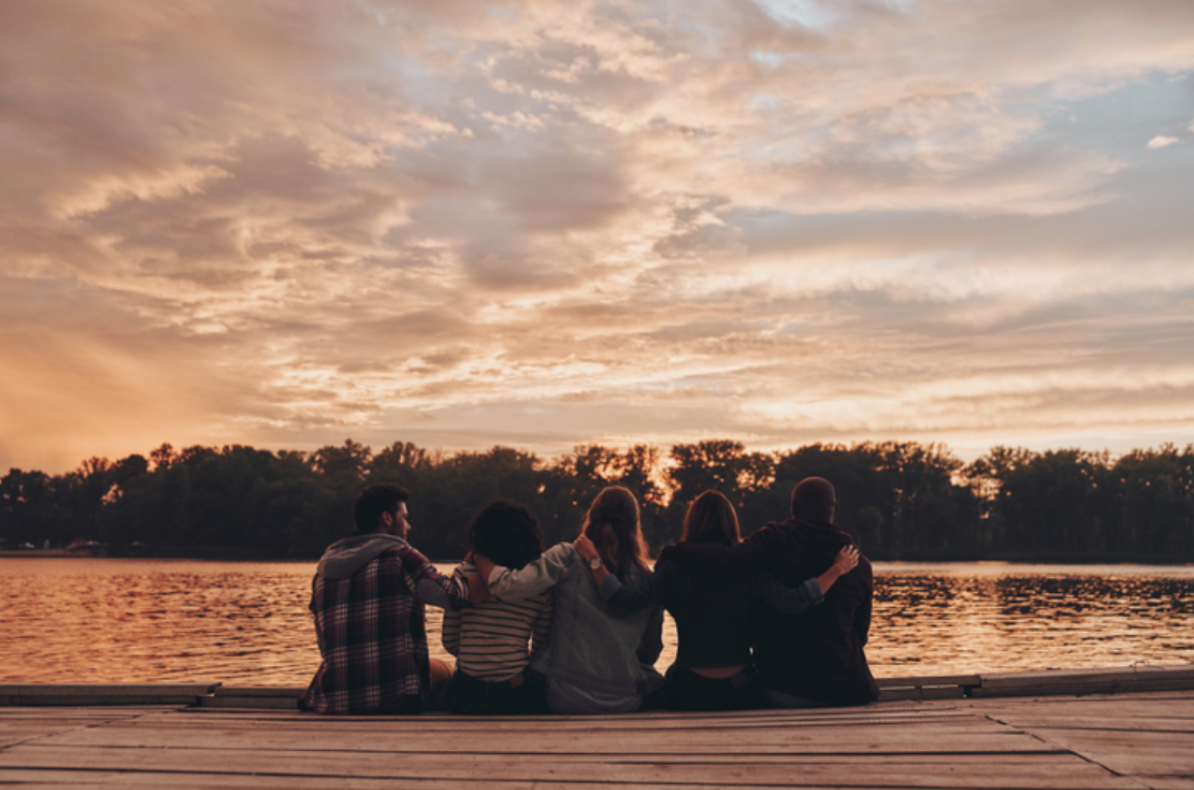 Mobilizers watching the sunset after finishing their tourism jobs for the day in Lake of the Woods, Ontario.